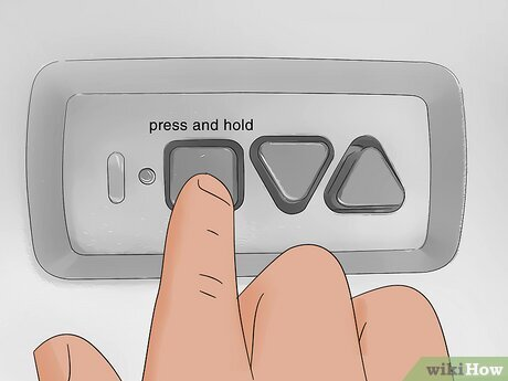 Where Is Program Reset Button On Genie Garage Door Opener